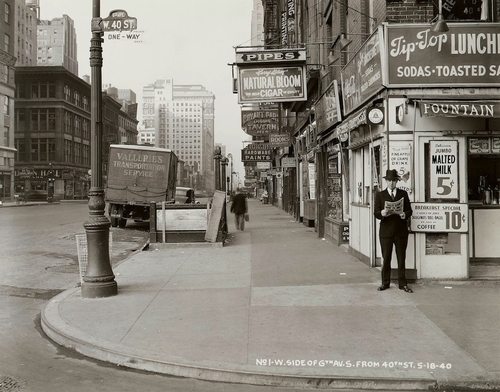 “In this May 18, 1940 photo, a man reads a newspaper on New York’s 6th Ave. and 40th St, with the headline: “Nazi Army Now 75 Miles From Paris.”